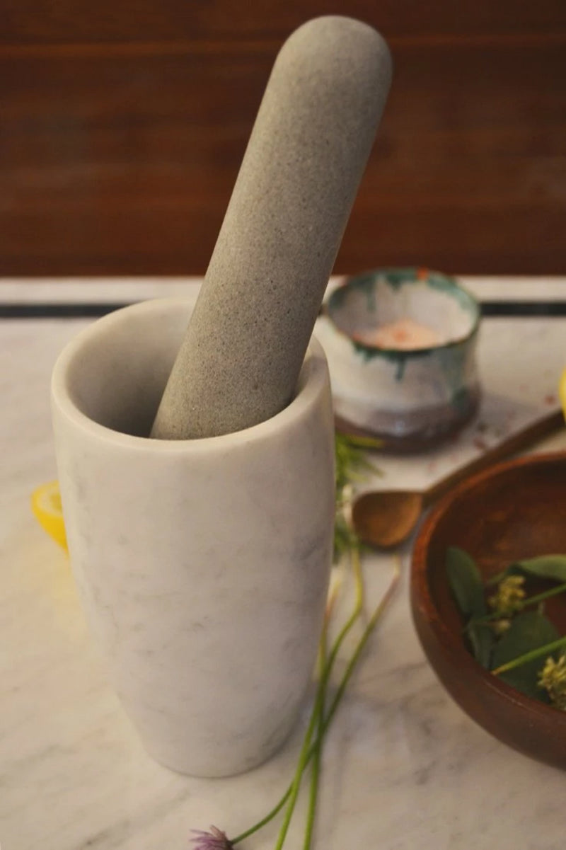 pestle and mortar carrara marble on table
