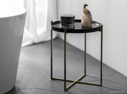 black marble coffee table with object on the top
